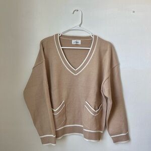 Tan and white v-neck sweater with pockets